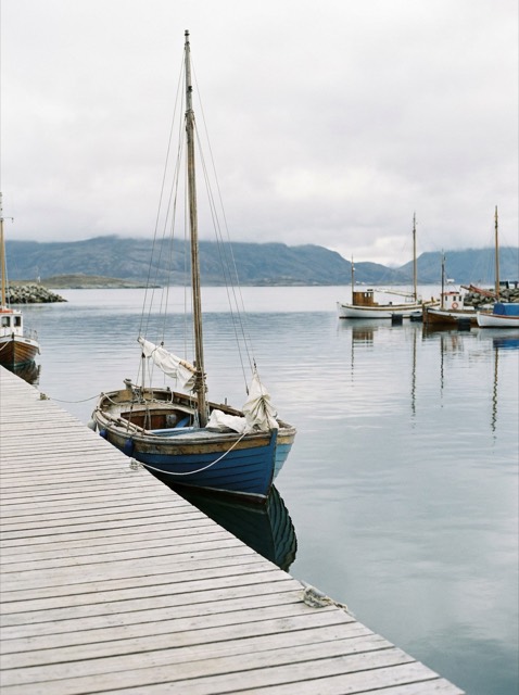 A calm harbour at midday in natural neutral color